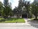 Cozy single-story home with a well-manicured lawn at 1060 E Tee Cir, Bartow, FL 33830