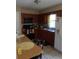 Updated kitchen features wood cabinets and a breakfast bar at 1060 E Tee Cir, Bartow, FL 33830