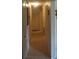 Long hallway with tile floors and access to bedrooms at 1060 E Tee Cir, Bartow, FL 33830
