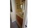 Bathroom with double vanity and mirrored medicine cabinets at 4000 Santa Maria Dr # 108, Kissimmee, FL 34741