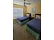 Bedroom with two twin beds and large window at 4000 Santa Maria Dr # 108, Kissimmee, FL 34741