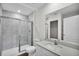 Bathroom with shower and tub, white vanity, and gray tile at 3422 Sw 165Th Loop, Ocala, FL 34473