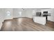 Living room and kitchen with wood-look floors at 3422 Sw 165Th Loop, Ocala, FL 34473