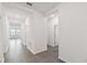 Bright hallway with tile floors and doors to other rooms at 1122 James Paul Rd, Davenport, FL 33837