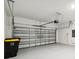 Garage with automatic door opener and epoxy floor at 1122 James Paul Rd, Davenport, FL 33837