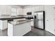 Modern kitchen with stainless steel appliances and an island at 1122 James Paul Rd, Davenport, FL 33837