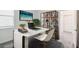 Bright home office with desk, shelving, and window at 1122 James Paul Rd, Davenport, FL 33837