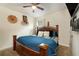 King-size bedroom with ceiling fan, wood furniture, and lots of light at 2272 Rose Blvd, Winter Haven, FL 33881