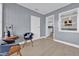 Cozy living area with grey shiplap walls and a view into the kitchen at 2541 Idlewild St, Lakeland, FL 33801