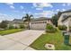 House exterior showcasing a two-car garage and well-manicured lawn at 6294 Manitoba Dr, Lakeland, FL 33805