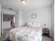 Second bedroom with a queen-size bed and access to a second floor at 8311 Foster Dr, Davenport, FL 33896