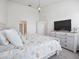 Spacious bedroom with king-size bed and ensuite bathroom access at 8311 Foster Dr, Davenport, FL 33896
