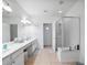 Double vanity bathroom with a large walk-in shower at 8311 Foster Dr, Davenport, FL 33896