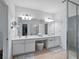 Bathroom features a double vanity and a large mirror at 8311 Foster Dr, Davenport, FL 33896
