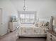 Main bedroom with a king-size bed and plenty of natural light at 8311 Foster Dr, Davenport, FL 33896