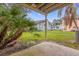 Private patio with view of grassy area and trees at 2040 Royal Bay Blvd # 31, Kissimmee, FL 34746