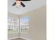 Bright bedroom with large windows and ceiling fan at 2040 Royal Bay Blvd # 31, Kissimmee, FL 34746