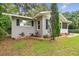 Newly painted house with black shutters and well-manicured lawn at 215 Young Pl, Lakeland, FL 33803