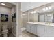 Double vanity bathroom with walk-in shower and toilet at 14234 Lanikai Beach Dr, Orlando, FL 32827