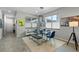 Elegant dining area with a glass-top table and modern chairs at 14234 Lanikai Beach Dr, Orlando, FL 32827