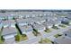 Aerial view of a large community with many houses at 14234 Lanikai Beach Dr, Orlando, FL 32827