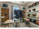 Bright home office features built-in shelving, large monitor, and workspace at 14234 Lanikai Beach Dr, Orlando, FL 32827