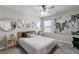 Charming bedroom with a queen bed and stylish decor at 14234 Lanikai Beach Dr, Orlando, FL 32827