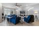 Spacious living room featuring a sectional sofa and a large TV at 14234 Lanikai Beach Dr, Orlando, FL 32827