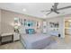 Bright bedroom with king-size bed and ensuite bathroom at 14234 Lanikai Beach Dr, Orlando, FL 32827