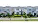 Two-story house with white and gray siding, surrounded by other homes at 14234 Lanikai Beach Dr, Orlando, FL 32827