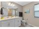 Double vanity bathroom with toilet and updated fixtures at 14234 Lanikai Beach Dr, Orlando, FL 32827