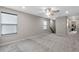 Spacious loft area with carpeted floor and ceiling fan at 14234 Lanikai Beach Dr, Orlando, FL 32827