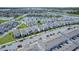 Aerial view of a house in a community with a lake at 14234 Lanikai Beach Dr, Orlando, FL 32827