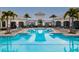 Resort-style community pool with plenty of lounge chairs at 14234 Lanikai Beach Dr, Orlando, FL 32827