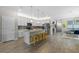 Modern kitchen with a large island and stainless steel appliances at 14234 Lanikai Beach Dr, Orlando, FL 32827