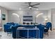 Open living room with sectional sofa, large TV, and modern decor at 14234 Lanikai Beach Dr, Orlando, FL 32827
