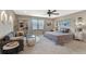Spacious bedroom with sitting area and large windows at 14234 Lanikai Beach Dr, Orlando, FL 32827