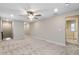 Bright loft area with carpeted floors and ceiling fan at 14234 Lanikai Beach Dr, Orlando, FL 32827