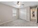 Spacious bedroom with double doors to the closet and ceiling fan at 14234 Lanikai Beach Dr, Orlando, FL 32827