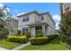 Two-story house with gray siding, landscaping, and a walkway at 14234 Lanikai Beach Dr, Orlando, FL 32827