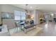 Bright dining room with a glass-top table and modern decor at 14234 Lanikai Beach Dr, Orlando, FL 32827