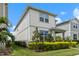 Two-story house with gray siding and landscaping, in a neighborhood at 14234 Lanikai Beach Dr, Orlando, FL 32827