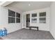 Covered patio with access door, windows, and small bench at 14234 Lanikai Beach Dr, Orlando, FL 32827