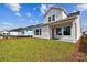 Two-story house exterior view showcasing backyard at 3062 Bootlace Way, Saint Cloud, FL 34771