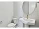 Clean bathroom with pedestal sink and toilet at 3062 Bootlace Way, Saint Cloud, FL 34771