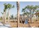 Wooden playground with slides and palm trees at 3062 Bootlace Way, St Cloud, FL 34771