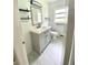 Modern bathroom with gray vanity and updated fixtures at 118 5Th Jpv St, Winter Haven, FL 33880