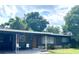 Ranch home with dark exterior and carport at 118 5Th Jpv St, Winter Haven, FL 33880