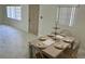 Bright dining area with tile floors and a table set for a meal at 118 5Th Jpv St, Winter Haven, FL 33880