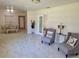Bright living room featuring tile floors and comfortable armchairs at 118 5Th Jpv St, Winter Haven, FL 33880